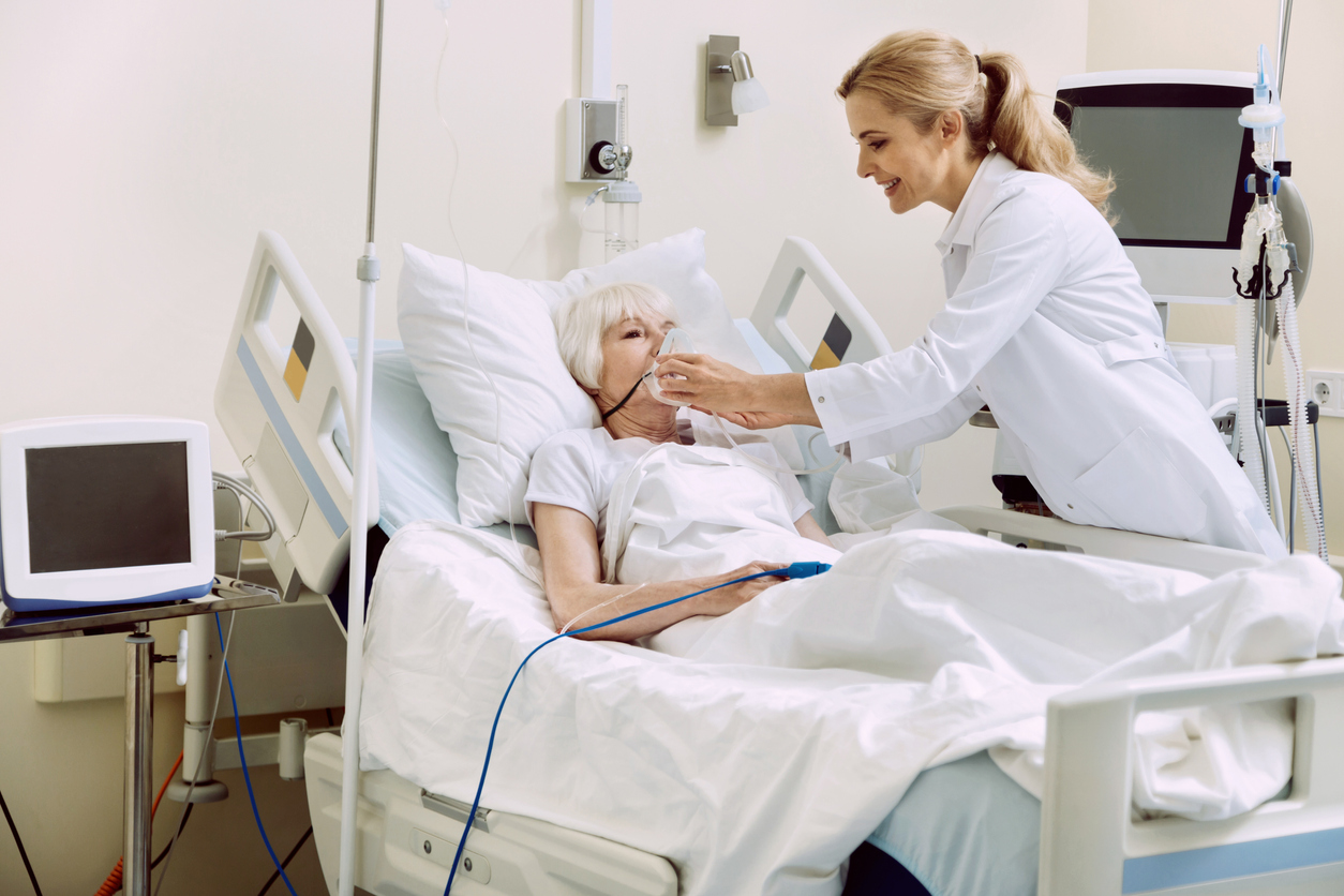 Respiratory Therapist adjusting respiratory support for a patient
